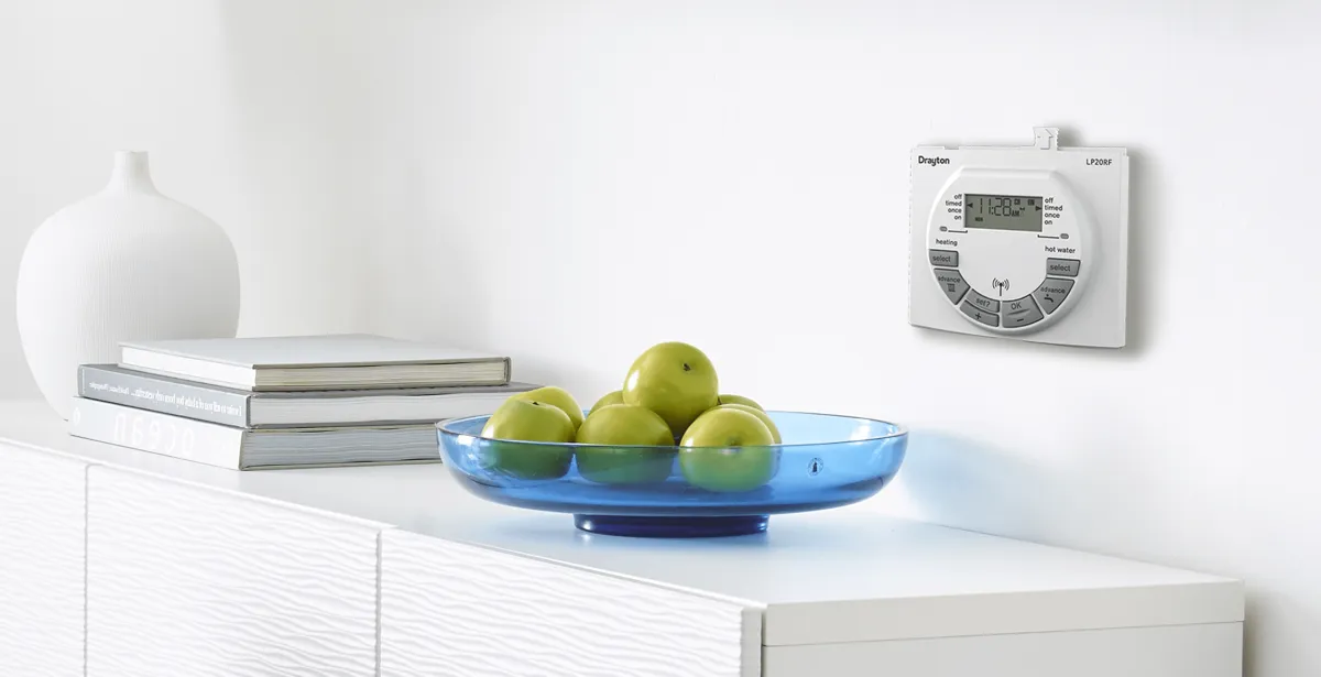 Control box on wall with fruit bowl on shelf